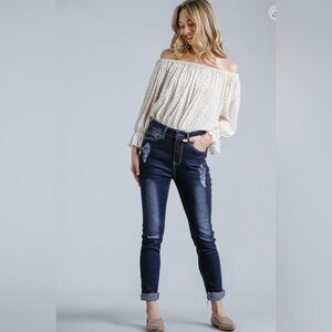 Umgee distressed dark blue jean. Can roll up/leave down. Jeans have stretch